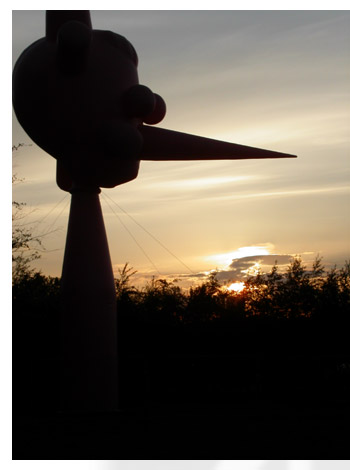 the huge pink inflatable Pinnochio-like sculpture stands guard outside of the Tate Modern at sunset.